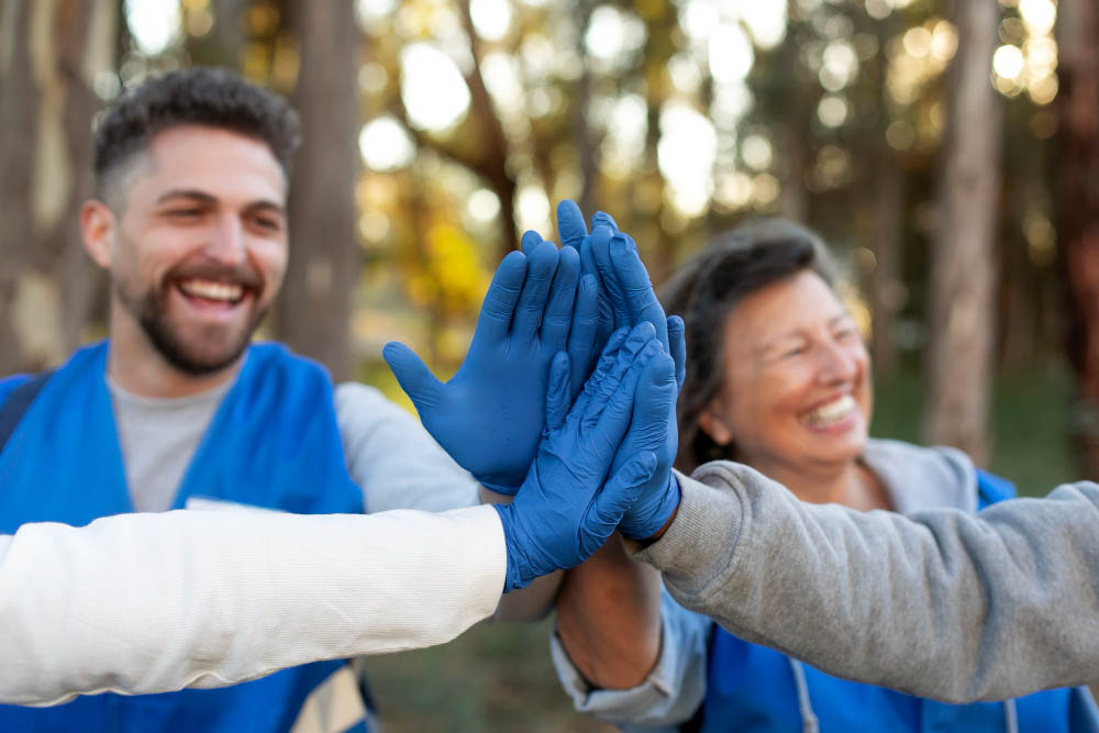 Close-up of happy volunteers working together on charity projects